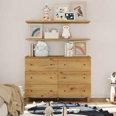 a child's room with a dresser and toys