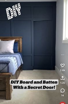 a bed room with a neatly made bed next to a blue wall and a window