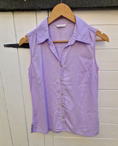 "90s Y2K semi fitted lilac sleeveless shirt By Marks and Spencer Size UK10 US6 lightweight soft easy wear summer blouse Measurements: Pit to pit 18\" Length 24\" Waist 15\" across Fabric: lyocell Spare button attached All orders are shipped using biodegradable and recycled packaging where possible" Summer Purple Shirt With Button Closure, Purple Button-up Shirt For Summer, Summer Purple Button-up Shirt, Casual Collared Tank Top For Summer, Fitted Sleeveless Blouse For Spring, Lavender Cotton Shirt For Summer, Purple Cotton Sleeveless Blouse, Sleeveless Purple Cotton Blouse, Lavender Cotton Summer Shirt