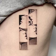 a woman's lower back tattoo with two faces