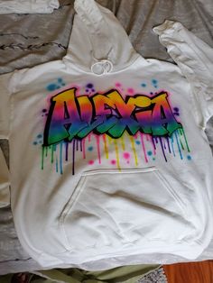 a white hoodie with the word awesome painted on it