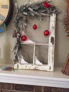 an old window decorated for christmas with ornaments