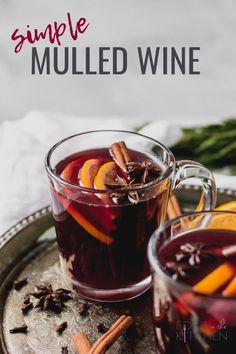 two glasses of mulled wine on a tray