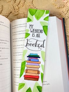 an open bookmark with the words my weekend is all booksed written on it