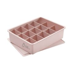 an empty pink container with compartments in it