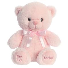 a pink teddy bear with the words my first on it