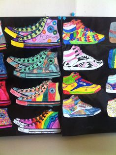 there are many pairs of colorful shoes on the display shelf in front of each other