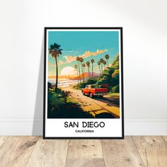 a poster with the words san diego in front of a white wall and wooden floor