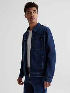 The Vann Jacket is a reimagined trucker in a relaxed fit with a dark wash, zip-up styling, and long, roomy sleeves. It's detailed by square patch pockets at the chest and side welt pockets. Part of our Circular Denim initiative from The Jean of Tomorrow™ collection, Vann comes in 12.5 oz. Revival Denim made from recycled AG jeans. The fabric features a soft cotton blend with a bit of stretch for added comfort.Revival Denim, 12.5 oz. 64% Cotton 34% Lyocell, 2% Elastane Relaxed Fit Dark Wash Outerwear With Welt Pockets, Utility Outerwear With Multiple Pockets In Dark Wash, Dark Wash Relaxed Fit Outerwear With Flap Pockets, Relaxed Fit Dark Wash Outerwear With Flap Pockets, Dark Wash Outerwear With Multiple Pockets For Fall, Urban Dark Wash Denim Jacket With Patch Pockets, Dark Wash Outerwear With Welt Pockets For Fall, Dark Wash Relaxed Fit Utility Jacket With Flap Pockets, Medium Wash Outerwear With Welt Pockets For Fall