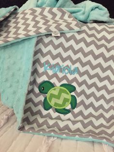 a baby blanket with a turtle on it