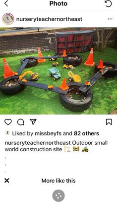 an image of some construction equipment in the grass with cones on it and one is being used