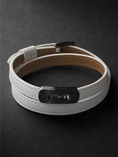 Messika's bracelet features the brand's 'Move' signature, the charm embedded in the plaque glides freely as your wrist sways. It's crafted from leather with DLC-coated titanium hardware. Each Messika piece comes with a two-year warranty, which is activated 28 days after purchase. To receive an additional year's warranty, register your piece on Messika's website. Luxury White Bracelets For Everyday, Luxury Everyday Leather Bracelet, Luxury Silver Leather Bracelet With Palladium Hardware, Luxury Silver Leather Bracelet With Stainless Steel, Luxury Silver Stainless Steel Leather Bracelet, Modern Bracelets With Magnetic Closure As Gift, Luxury Leather Bracelet For Everyday, Luxury Stainless Steel Bracelets, Timeless White Bracelet For Everyday Luxury