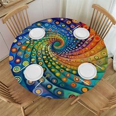 the table is set with white plates and placemats, which are decorated with an artistic swirl design