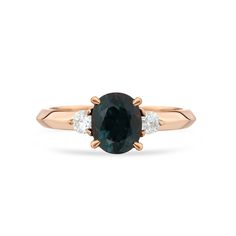 an oval cut green sapphire and diamond ring