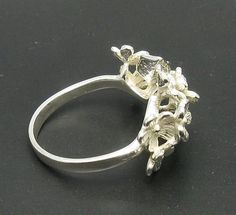 Sterling silver ring 925/1000, flower. Stamped 925.Approximate weight 4.4 grams. Top width 1.5 cm (0.60 inches). All our jewels are made from solid sterling silver 925/1000 and are carefully crafted by hand in our family workshop. We dispatch your orders in 5 working days, worldwide and the postage is $5. We ship registered priority mail. Please allow 5-7 working days for delivery in Europe and 10-15 working days outside Europe. For any questions - please do not hesitate to contact me! Handmade Silver Flower Ring For Formal Occasions, Silver Handmade Flower Ring For Formal Occasions, Formal Silver Open Ring With Flower Design, Formal Silver Flower Open Ring, Silver Hallmarked Flower Ring For Formal Occasions, Silver Flower Ring With Polished Finish For Formal Occasions, Formal Silver Flower Ring With Polished Finish, Formal Flower Shaped Rings Stamped 925, Formal Oval Sterling Silver Flower Ring