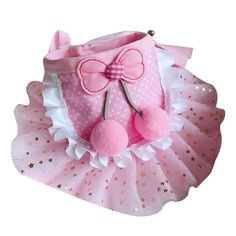 a pink teddy bear in a tutu skirt