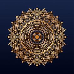 a golden circular ornament on a black background with an intricate design in the center