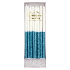 blue and white candles in a package