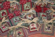 a bunch of christmas ornaments are sitting on the floor next to each other and tied together with burlap