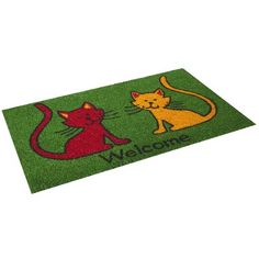 a green door mat with two cats on it and the word welcome written in red