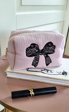 Looking for the perfect gift for her this holiday season? Our Lace Bow Makeup Pouch is the ideal combination of elegance and practicality. Made from soft, breathable muslin fabric, this cosmetic bag features a beautifully handcrafted black lace bow, adding a touch of timeless charm. Whether you need a stylish way to store your beauty essentials or a thoughtful Christmas gift for a loved one, this pouch is a must-have!