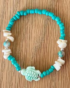 Beautiful Turquoise Ceramic Turtle and Shell Stretch Bracelet with Glass Beads with Silver Plated accent beads.  Perfect gift / Made by me in the USA/ Free shipping in USA! Stretch bracelet fits most 6 1/2-7 " wrists.  You are purchasing 1 bracelet. Perfect for Vacation/summer wear! Beautiful gift to any woman in your life!❤️ Recommended to remove when using water. Process time is 1-2 days, will ship with USPS First Class Mail . Enjoy your new beauty! Ceramic Turtle, Hippie Bracelets, Bracelet Ideas, Stretch Bracelet, Summer Wear, Stretch Bracelets, Bracelet Set, Beaded Bracelet, Favorite Jewelry