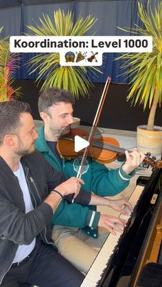 two men sitting at a piano and playing music on the same keyboard, with words koordination level 100 above them