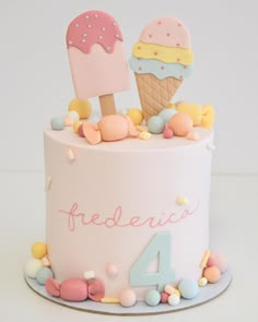 a birthday cake decorated with ice cream and candies