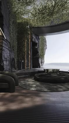 a living room filled with lots of furniture next to a tree covered wall and water