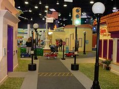 the inside of a toy store with lots of toys on display and people walking around