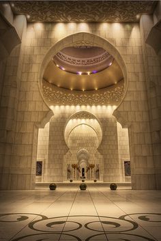 the inside of a building with an intricate design on it's walls and ceiling