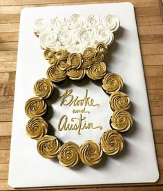 a white and gold cake with flowers on it that says, broke and quitin