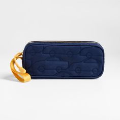 A fun pencil case that's built to handle all the thrills of the day. A pattern of quilted cars zoom across the bag's navy blue exterior, and contrasting yellow zipper, zipper pull and loop handle give it the perfect finish. Constructed of supremely durable polyester fabric that includes recycled plastic bottles, our roomy, easy-clean case makes it simple to keep all their pens and pencils organized and accessible. Pair with the Quilted Blue Car lunch box and matching backpack for a totally coord Blue Rectangular Pencil Case With Zipper Closure, Blue Rectangular Pencil Case With Zipper, Blue Travel Pencil Case With Zipper Pocket, Travel Blue Pencil Case With Zipper Pocket, Blue Pencil Case With Zipper Pocket For School, Functional Blue Pencil Case With Zipper Pocket, Kids Pencil Case, Blue Exterior, Pencil Organizer