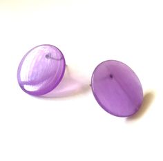 Incredibly mod and so today! These are translucent marbled purple stud earrings in a retro mod disc shape. Just under 1" or 22mm in diameter and wafer thin, these button earrings are the perfect mix of classic and mod retro. The model is wearing a similar shape & size - just to give you an idea of the look.All earrings are made with vintage lucite parts that were made in Rhode Island in the 1960's - early 80's by Best Plastics. We hand-set them with surgical steel earring posts and they have Double Sided Earrings, Lucite Jewelry, Surgical Steel Earrings, Square Earrings Studs, Square Stud, Moon Glow, Button Earrings, Earring Posts, Vintage Lucite