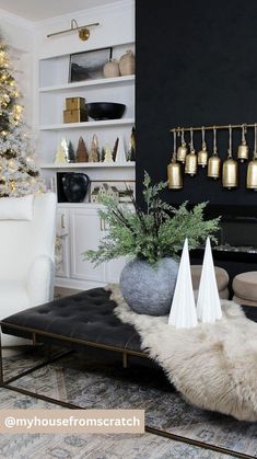 a living room filled with furniture and a christmas tree