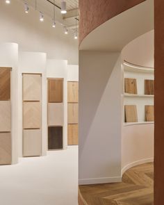 a room filled with lots of different types of wooden flooring next to a white wall