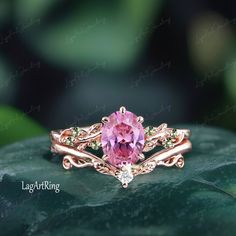 Oval cut Pink Sapphire Engagement ring Rose Gold Promise Ring Leaf Nature Inspired Bridal Ring Sep Birthstone Gemstone Ring  Jewelry gifts Ring Details: - Theme:Romantic Wedding & Engagement - comfortable band - Stone:6*8mm lab created pink sapphire Side stones: Peridot - Total weight: 0.07 ctw (High Quality) - ring band width :1.5mm - ring thicknesses:1.2mm Wedding Band:0.035ctw Stones: lab created moissanite - ring band width :1.3mm - ring thicknesses:1.3mm - Metal choose:10k or 14k or 18k ros Gold Rose Engagement Ring, Pink Sapphire Engagement Ring Rose Gold, Sapphire Engagement Ring Rose Gold, Pink Sapphire Engagement Ring, Sapphire Side Stones, Pink Wedding Rings, Rose Gold Promise Ring, Gold Promise Ring, Pink Sapphire Ring Engagement