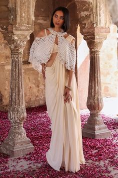 Ivory cold shoulder cape featuring floral applique and jaali patterns embellished by pearls and sequins. Comes with plain pre-stitched saree and padded blouse. - Aza Fashions Ivory Drapes, Cape Set, Saree Georgette, Stitched Saree, Shoulder Cape, Padded Blouse, Drape Saree, Indian Wedding Wear, International Style