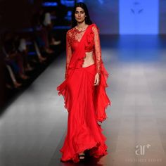 By designer Anushree Reddy, Bridelan: Personal Shoppers, Fashion Stylists and Luxury Consultants for South Asian and Indian weddings, based out of Mumbai, India. Email info.bridelan@gmail.com. Website www.bridelan.com  #LakmeFashionWeek #LakmeSalon #LakmeSalonBlockbusterBrides #LakmeSalonXAnushreeReddy #LFW #NewCollection #AnushreeReddyOfficial #AnushreeReddyDesigns #AnushreeReddyOutfit #AnushreeReddy #FashionOnInsta #IndianWear #Fashion #Love #Life #LifeStyle #Bridal #Bridelan Red Ruffle Saree, Saree Wedding Designer, Frill Saree, Bride Sarees, Wedding Wear Indian, Ruffle Sarees, Saree Wearing Styles, Indian Designs