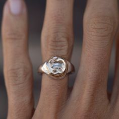 Recycled gold nugget, set on a sterling silver signet, featuring a baguette white diamond. one-of-a-kind Signet ring size 5.5 5mm x 3mm, white recycled VS2 baguette diamond signet face is repurposed 10K & 14K gold. band is 4mm wide Gold Nugget, Recycled Gold, Baguette Diamond, Gold Band, Signet Ring, White Diamond, Baguette, Jewelry Shop, Wine Glass