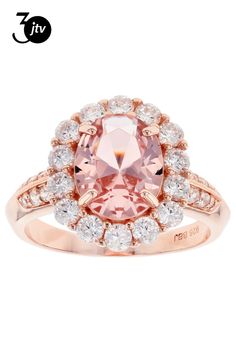 a ring with an oval pink stone surrounded by white and clear stones in the center