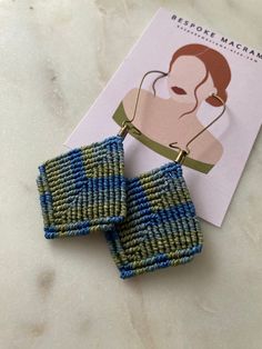 Multicolor blue cords are hand woven into a diamond shaped pattern to crest these dramatic statement earrings. This ultra lightweight design is on an oversized ear wire.  Custom color options available upon request.  Perfect day to night accessories. Woven Earrings, Macrame Earrings, Ear Wire, Shape Patterns, Diamond Shapes, Statement Earrings, Custom Color, Macrame, Multi Color