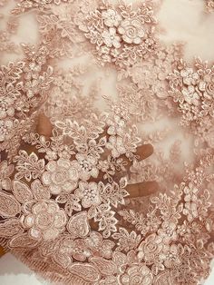 an intricately detailed lace with flowers on it