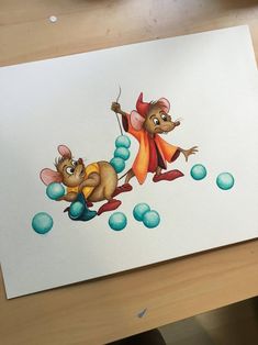 a drawing of two mice playing with balls on a table next to a computer mouse