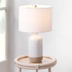 The warm hues and glaze of this textured ceramic table lamp add visual interest to any space. Handmade of ceramic, the intricate line patterns are highlighted in the natural and off-white glaze. Topped with a linen shade for a soft contrast and refined glow. Birch Lane™ | Birch Lane™ Ventura 24" Table Lamp 24.0 H x 14.0 W x 14.0 D in brown / whiteCeramic / Linen in White / Brown | 23" H X 14" W X 14" D | Wayfair Brown Table Lamp, Brown Ceramic, Fixture Table, Brown Table, Ceramic Table Lamp, Metal Table Lamps, Table Lamp Sets, Ceramic Base, White Table Lamp