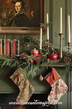 a mantle decorated with christmas stockings and candles