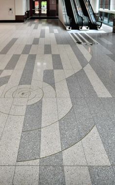 an escalator in the middle of a large building