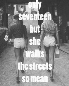 two women walking down a street with the words only seven but she walks the streets so mean