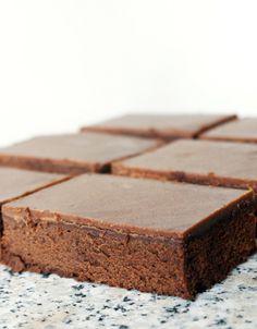 a close up of some brownies on a table