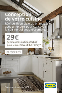 a kitchen with white cabinets and an advertisement for the french company le couvreur